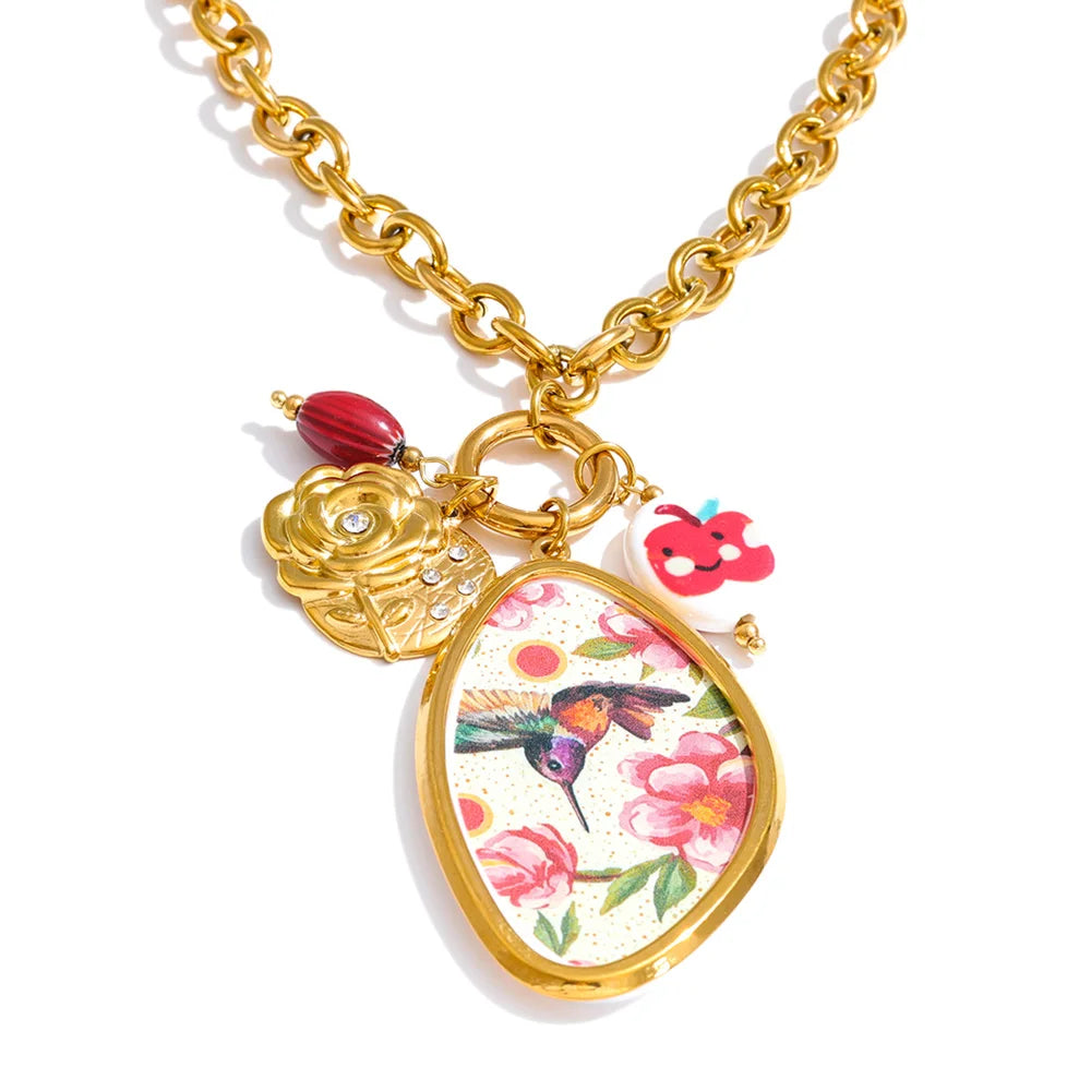 Cubic zirconia resin flower necklace in gold-plated stainless steel with cubic zirconia and resin.