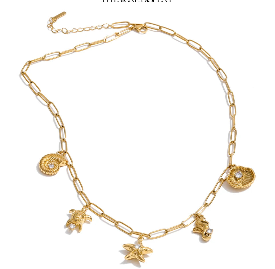 Cubic zirconia shell star necklace in gold-plated stainless steel with cubic zirconia and shell.
