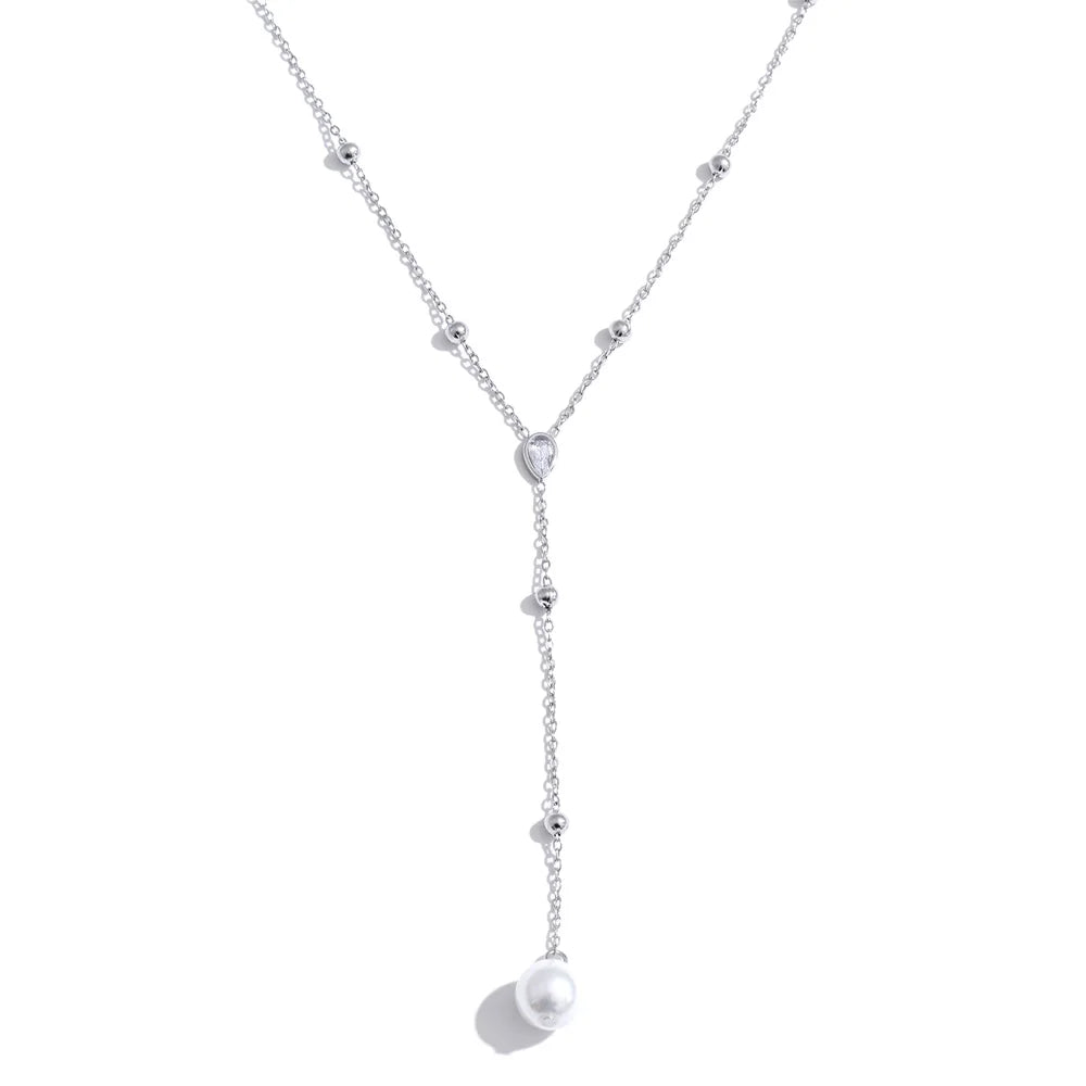 Cubic zirconia pearl geometric necklace in gold-plated stainless steel with pearl and cubic zirconia.