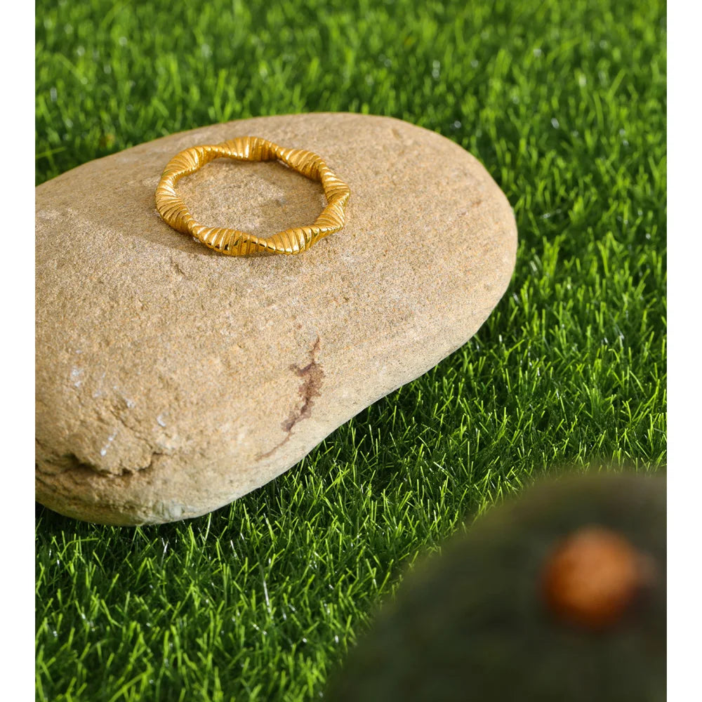 Geometric ring in 18K gold-plated stainless steel.