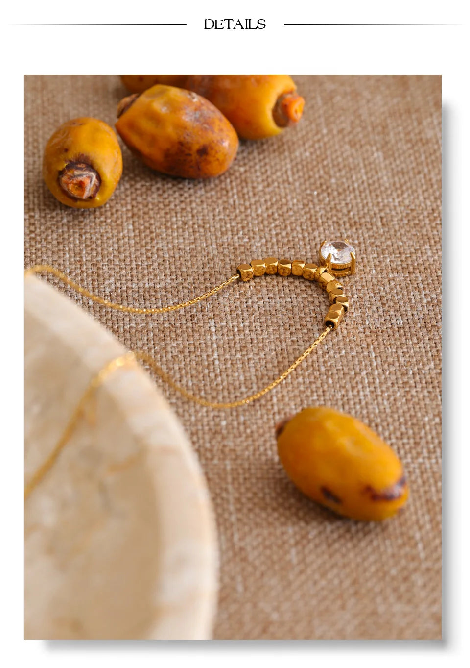 Cubic zirconia beaded geometric necklace in gold-plated stainless steel with cubic zirconia.