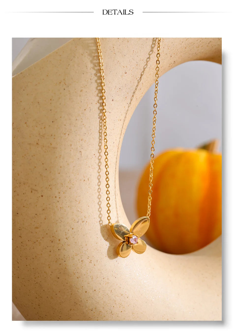 Cubic zirconia butterfly necklace in gold-plated stainless steel with cubic zirconia.