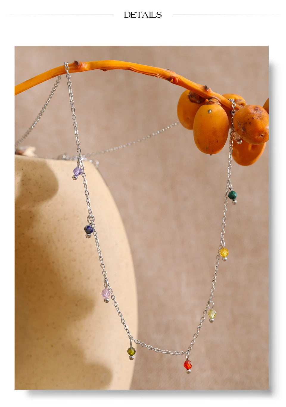 Cubic zirconia multi-color geometric necklace in gold-plated stainless steel with cubic zirconia.