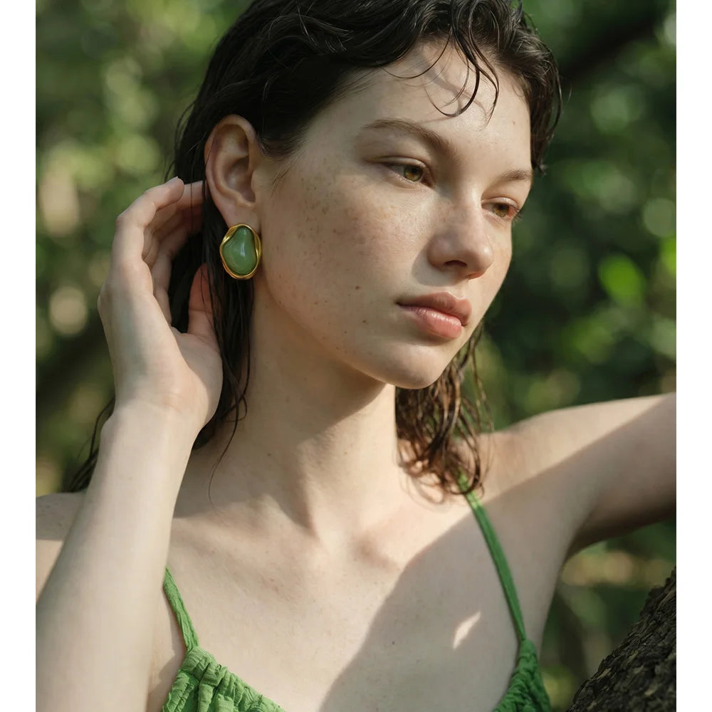 Resin acrylic geometric earrings in gold-plated stainless steel with resin and acrylic.