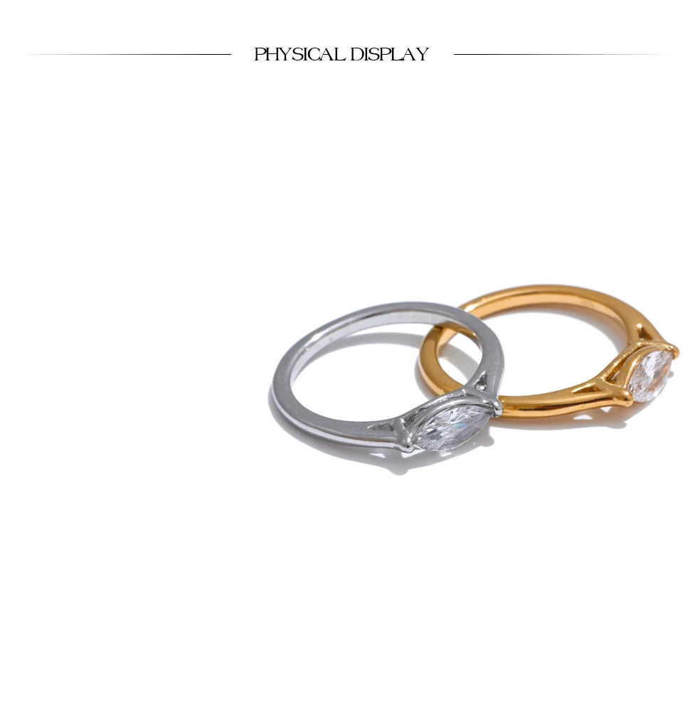 Cubic zirconia geometric ring in 18K gold-plated stainless steel with cubic zirconia.