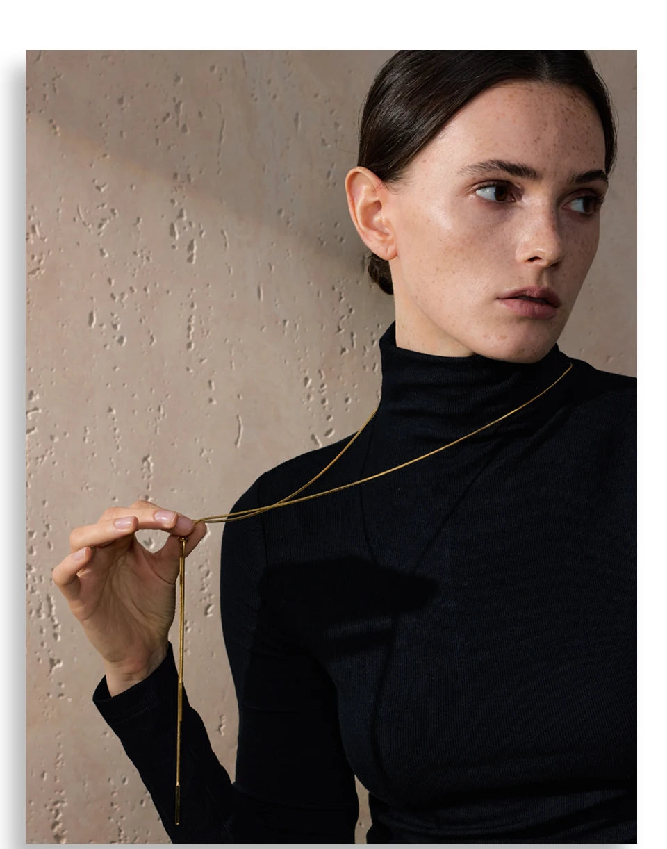 Geometric chain necklace in gold-plated stainless steel.
