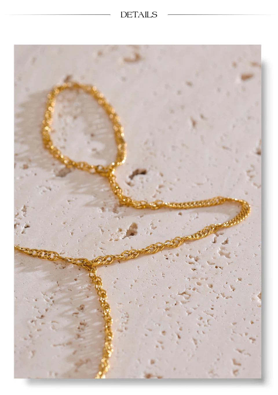 Minimalist geometric chain necklace in gold-plated stainless steel.