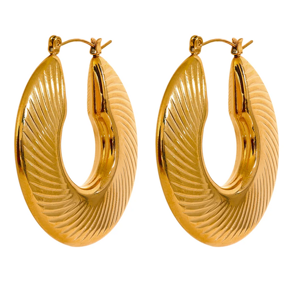 Gold-plated stainless steel earrings with a large, wavy design.