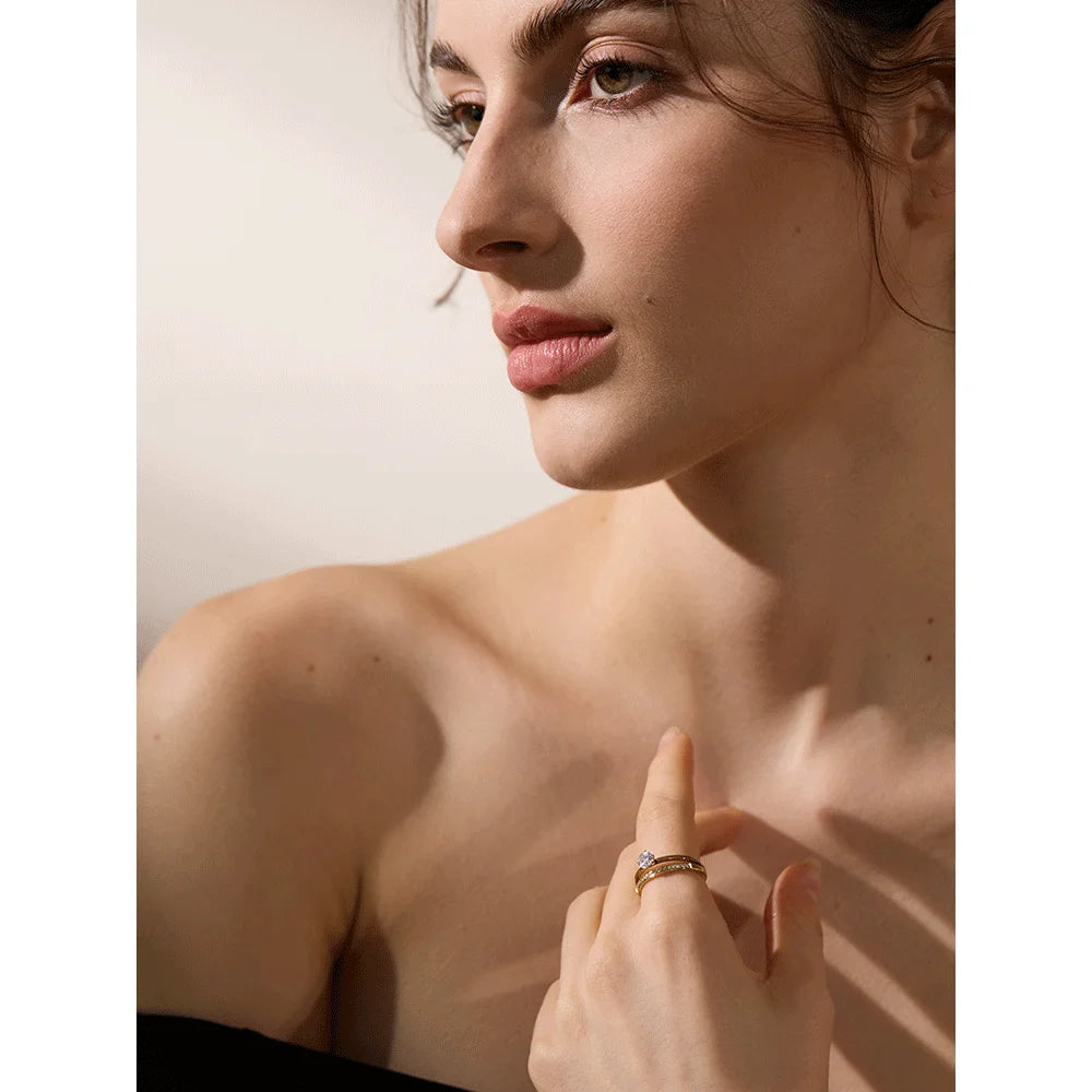 Cubic zirconia geometric layered ring in gold-plated stainless steel with cubic zirconia.