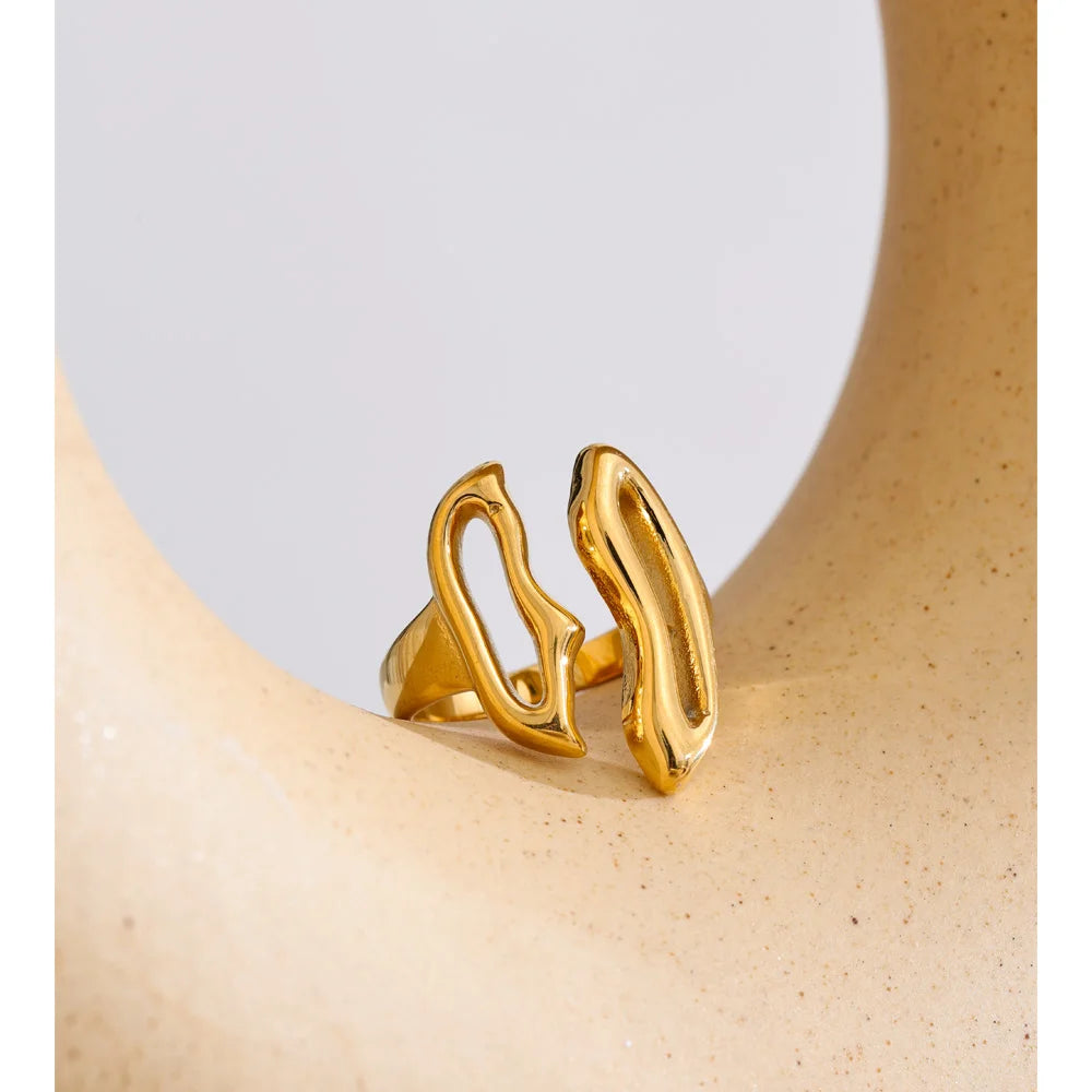 Geometric ring in gold-plated stainless steel.