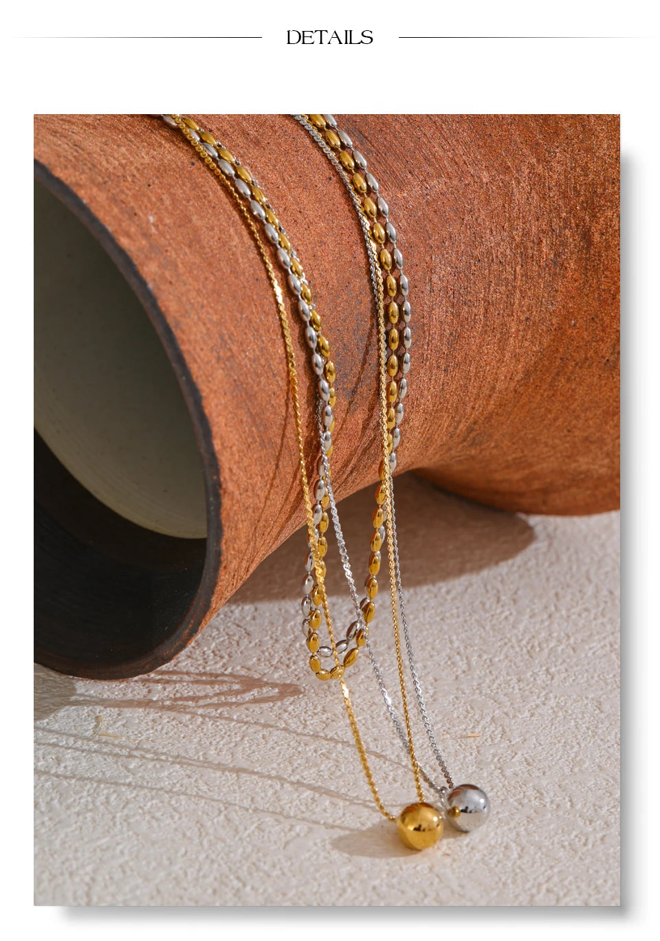 Geometric chain layered necklace in gold-plated stainless steel.