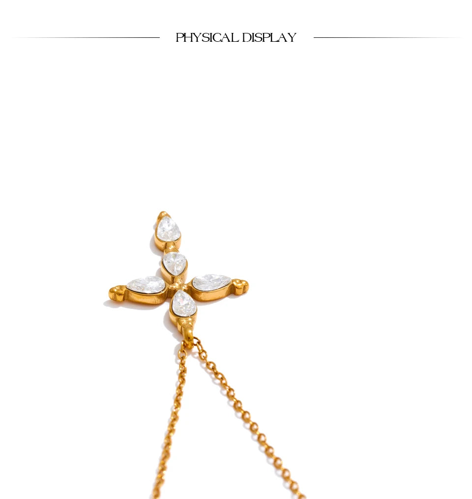 Cubic zirconia cross necklace in gold-plated stainless steel with cubic zirconia.