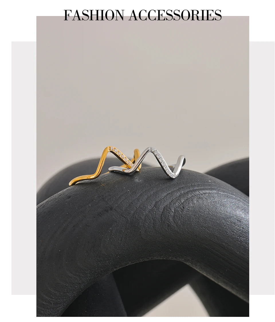 Cubic zirconia geometric ring in 18K gold-plated stainless steel with cubic zirconia.