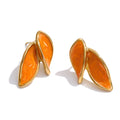 White enamel earrings in gold-plated stainless steel with enamel.