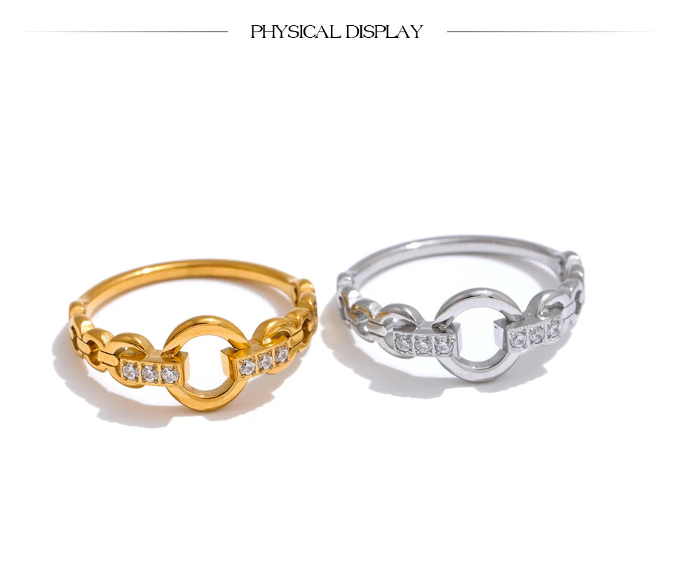 Cubic zirconia geometric ring in gold-plated stainless steel with cubic zirconia.