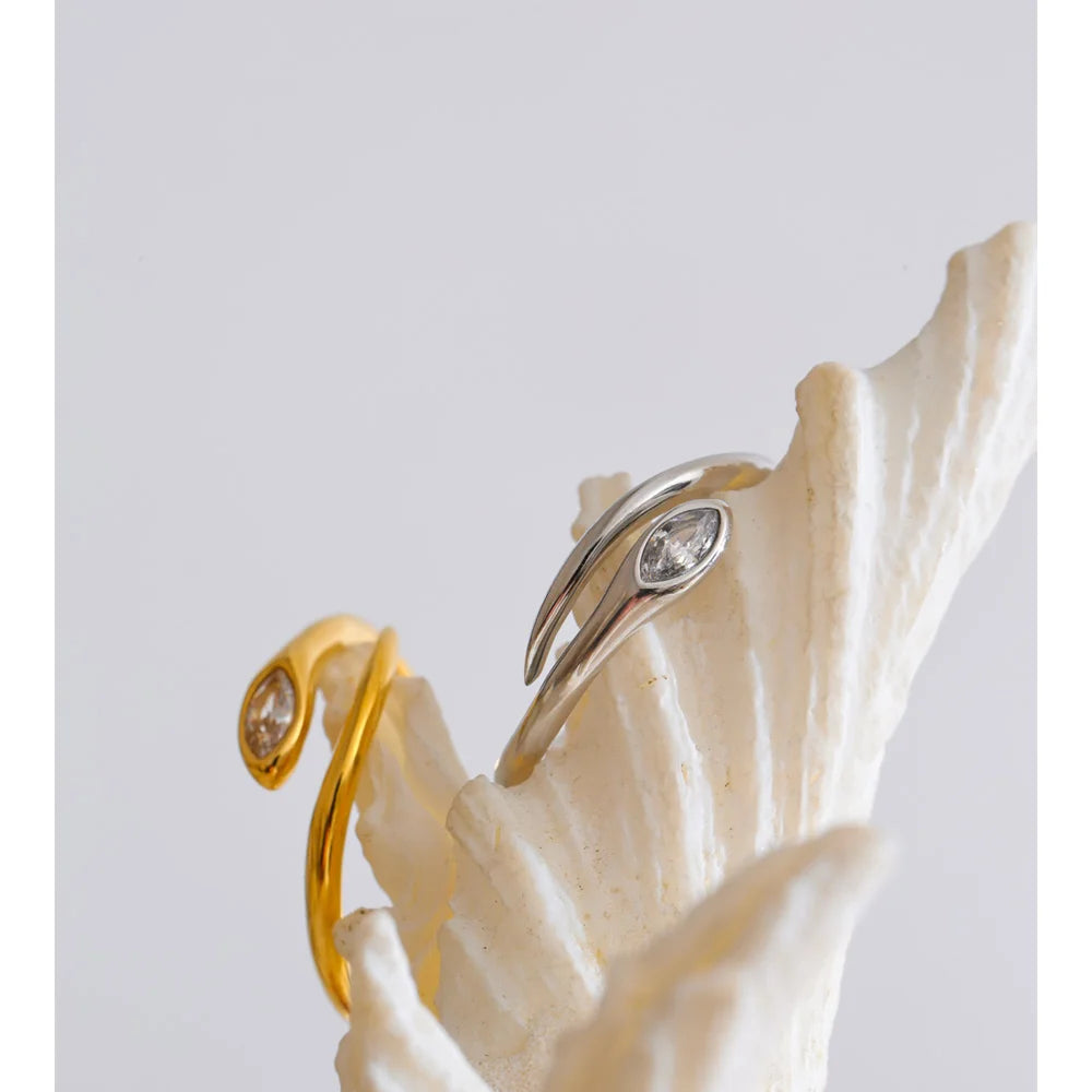 Cubic zirconia snake geometric ring in 18K gold-plated stainless steel with cubic zirconia.
