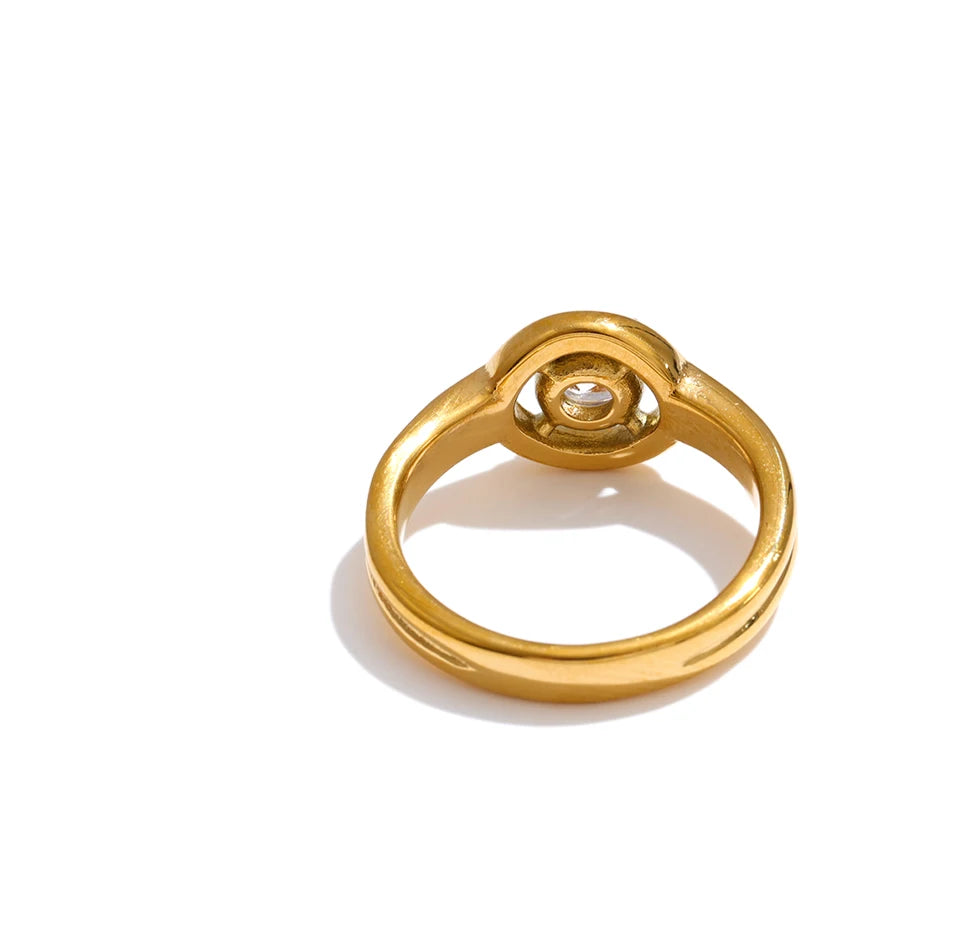Cubic zirconia geometric ring in 18K gold-plated stainless steel with cubic zirconia.