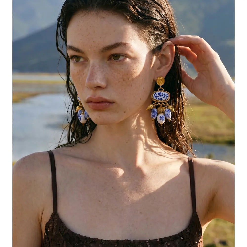 Blue heart flower earrings in gold-plated stainless steel.