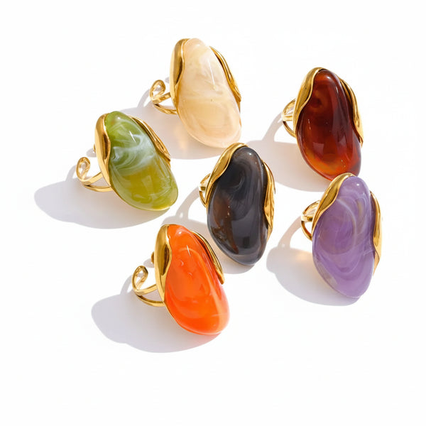 Gold-plated stainless steel ring with resin accents in a variety of colors.