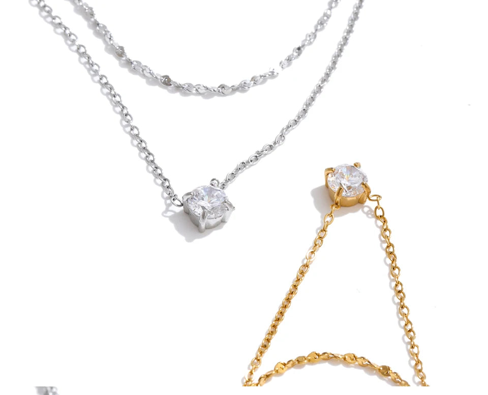 Cubic zirconia geometric chain necklace in gold-plated stainless steel with cubic zirconia.
