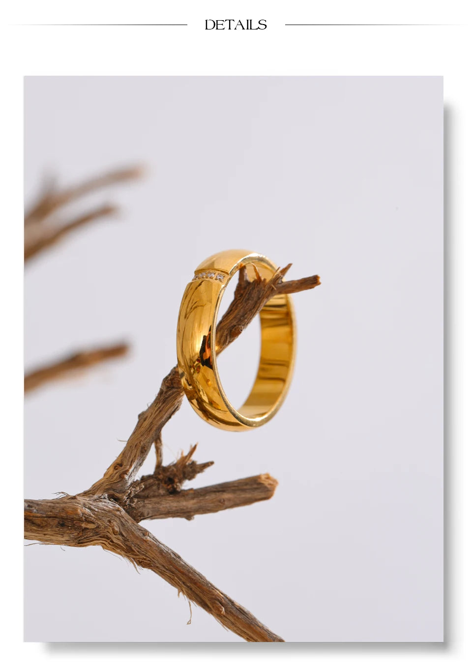 Cubic zirconia geometric ring in 18K gold-plated stainless steel with cubic zirconia.