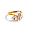 Cubic zirconia flower geometric ring in 18K gold-plated stainless steel with cubic zirconia.