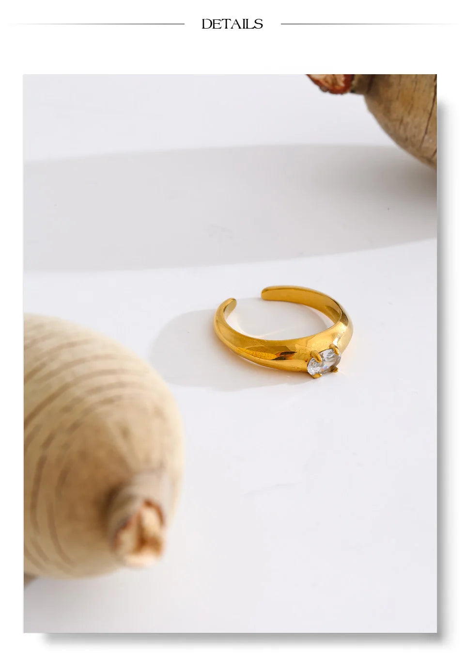 Cubic zirconia geometric ring in 18K gold-plated stainless steel with cubic zirconia.
