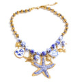 Star beaded geometric necklace in gold-plated stainless steel.