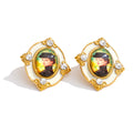Resin crystal geometric earrings in gold-plated stainless steel with resin and crystal.