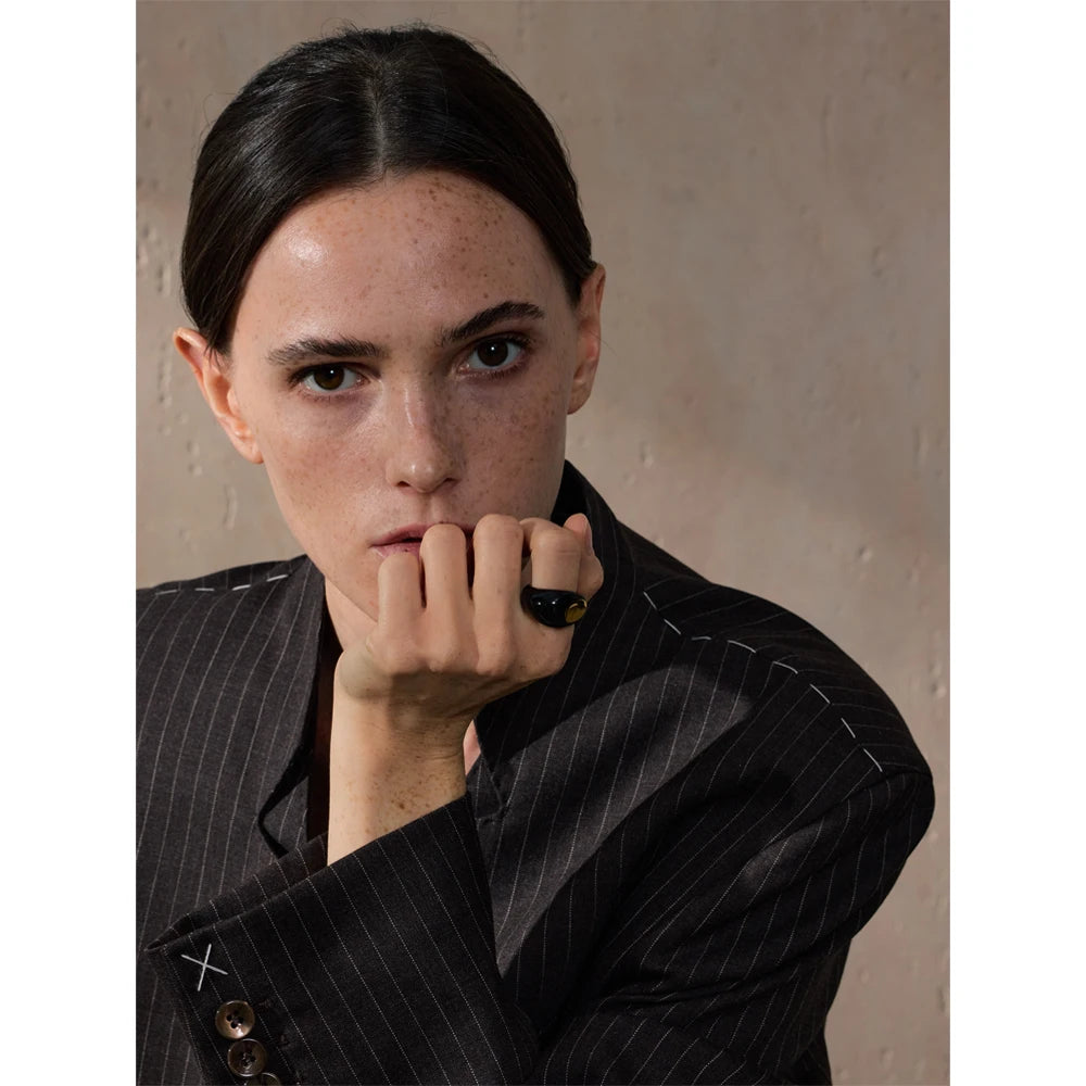 Black enamel geometric ring in gold-plated 316L stainless steel with enamel.