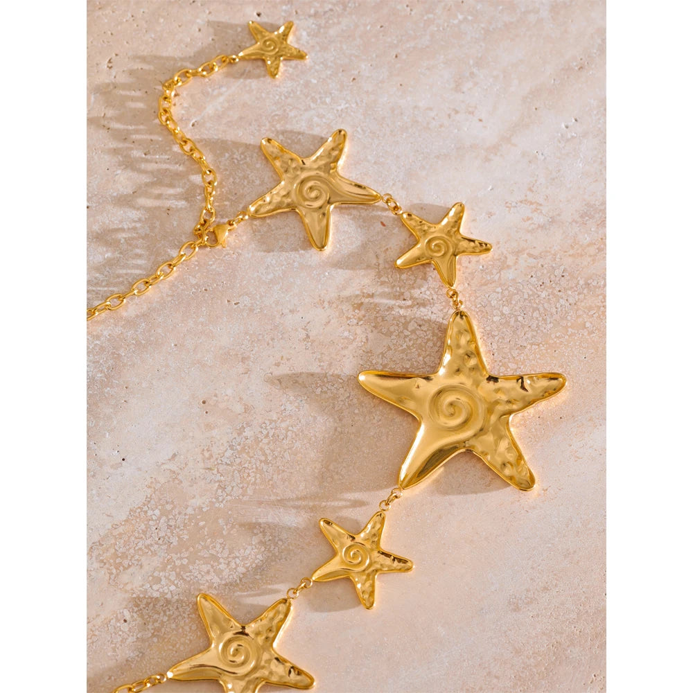 Star chain necklace in gold-plated stainless steel.