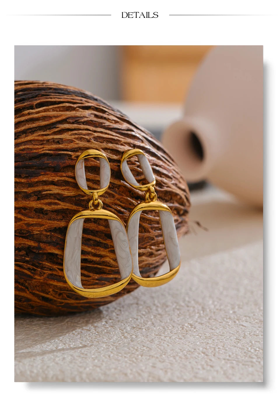 White enamel geometric earrings in gold-plated stainless steel with enamel.