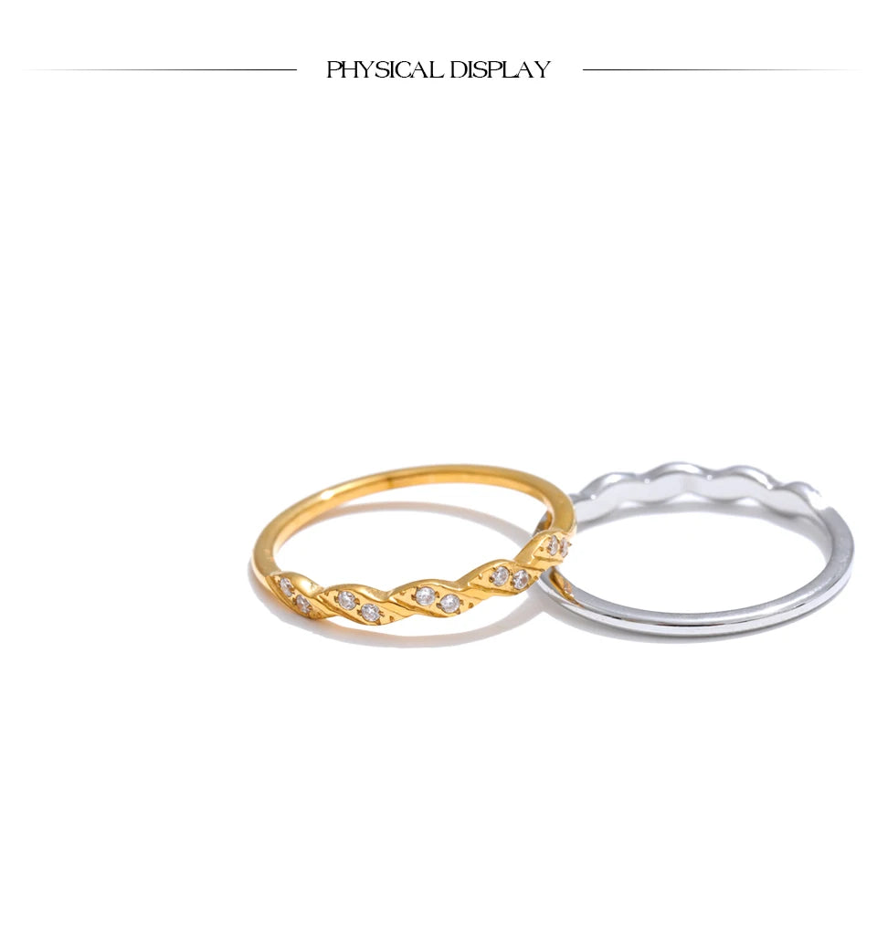 Cubic zirconia geometric ring in gold-plated stainless steel with cubic zirconia.