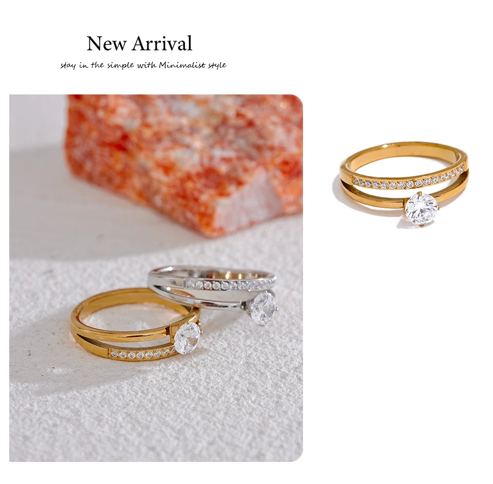 Cubic zirconia geometric layered ring in gold-plated stainless steel with cubic zirconia.