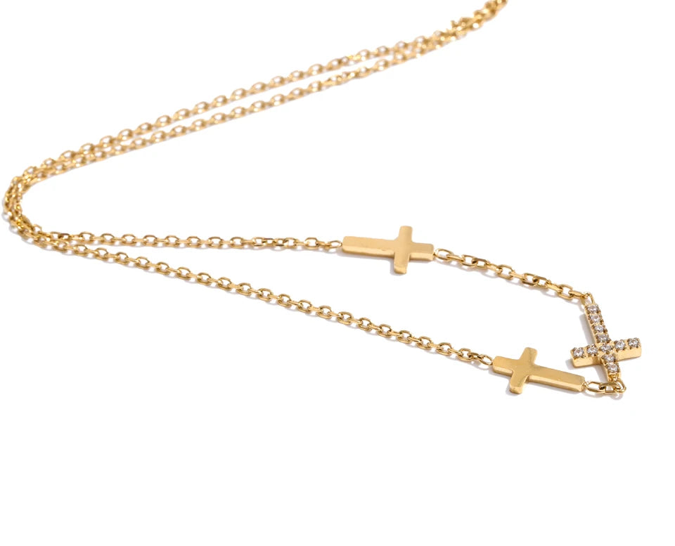 Cubic zirconia cross geometric necklace in gold-plated stainless steel with cubic zirconia.