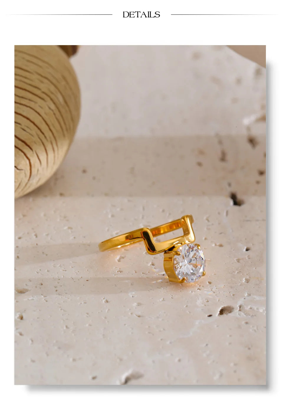Cubic zirconia geometric ring in 18K gold-plated stainless steel with cubic zirconia.