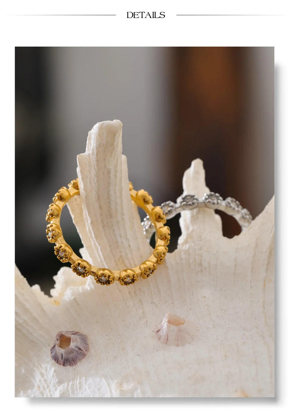 Cubic zirconia flower geometric ring in 18K gold-plated stainless steel with cubic zirconia.