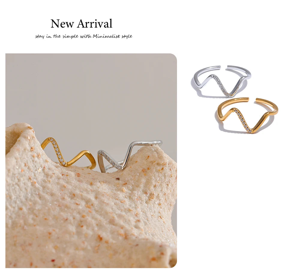 Cubic zirconia geometric ring in 18K gold-plated stainless steel with cubic zirconia.