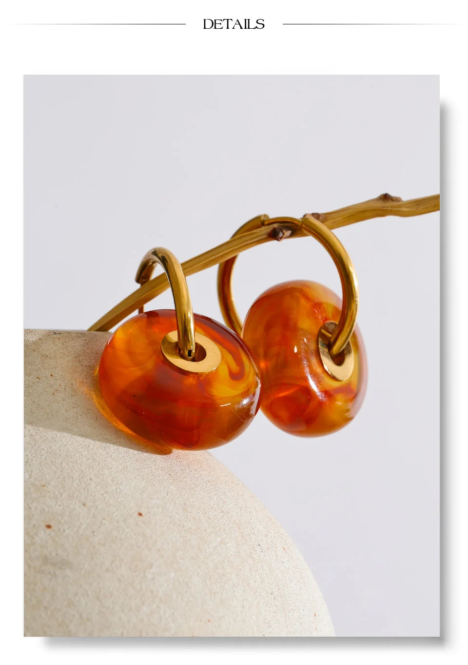 Resin acrylic geometric earrings in gold-plated stainless steel with resin and acrylic.