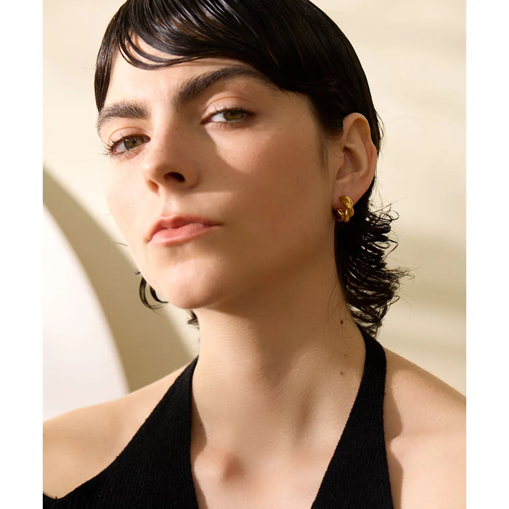 Geometric earrings in gold-plated 316L stainless steel.