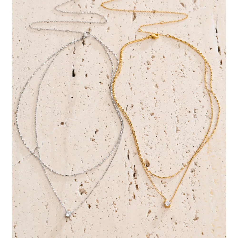 Cubic zirconia geometric chain necklace in gold-plated stainless steel with cubic zirconia.