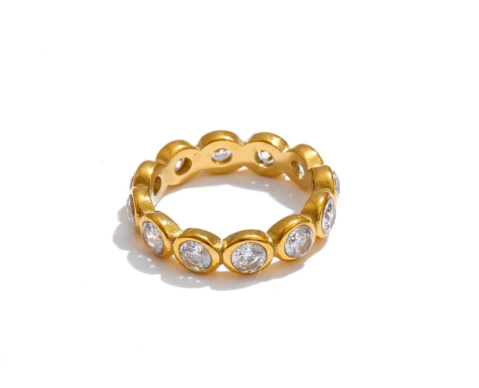 Cubic zirconia geometric ring in 18K gold-plated stainless steel with cubic zirconia.