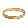 Cubic zirconia geometric ring in 18K gold-plated stainless steel with cubic zirconia.