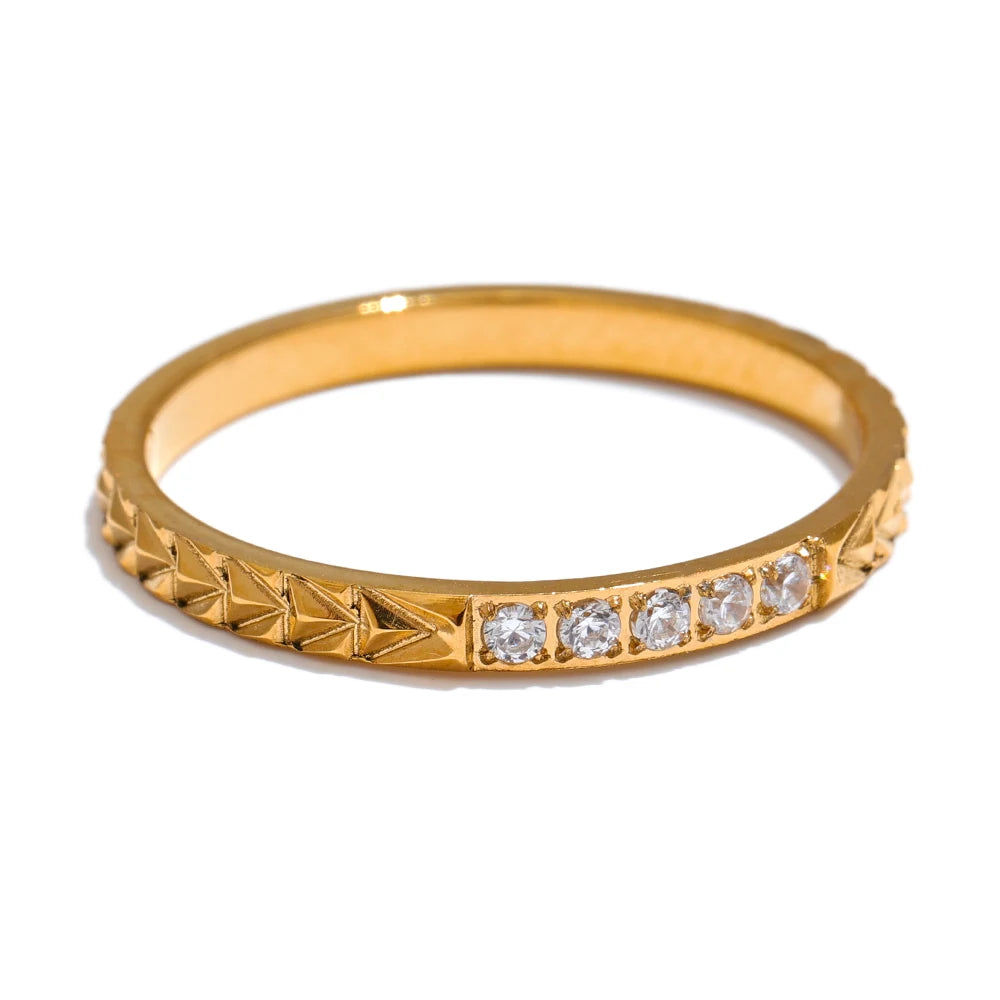 Cubic zirconia geometric ring in 18K gold-plated stainless steel with cubic zirconia.