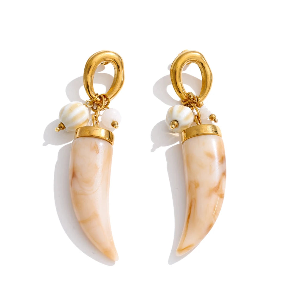 Resin acrylic geometric earrings in gold-plated stainless steel with resin and acrylic.