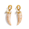 Resin acrylic geometric earrings in gold-plated stainless steel with resin and acrylic.