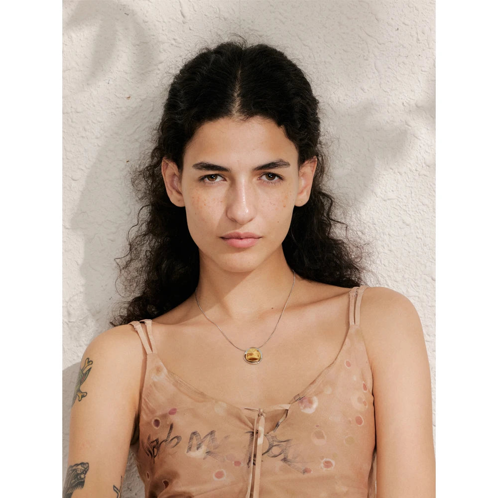 Coin geometric necklace in gold-plated stainless steel.