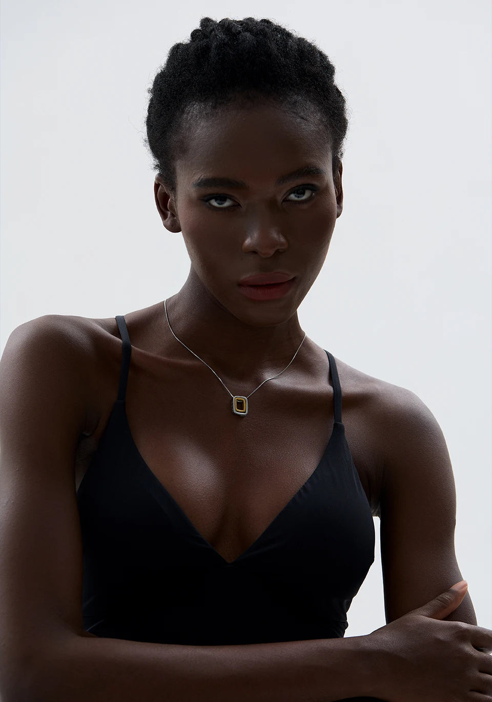 Geometric layered necklace in gold-plated 316L stainless steel.
