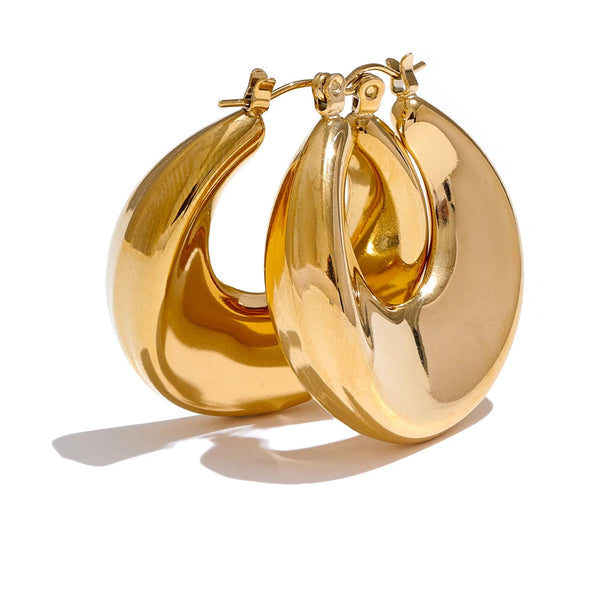 Gold-plated stainless steel earrings with a large, round design.