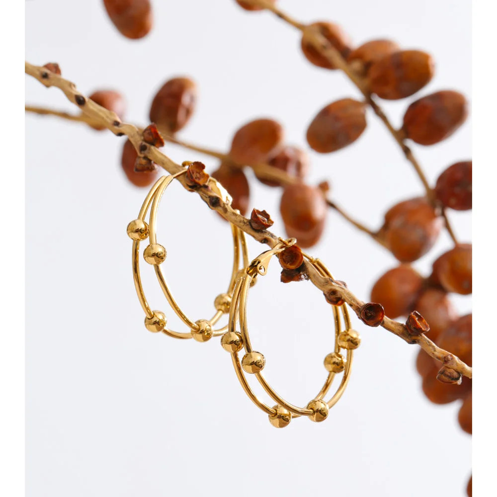 Geometric earrings in gold-plated stainless steel.
